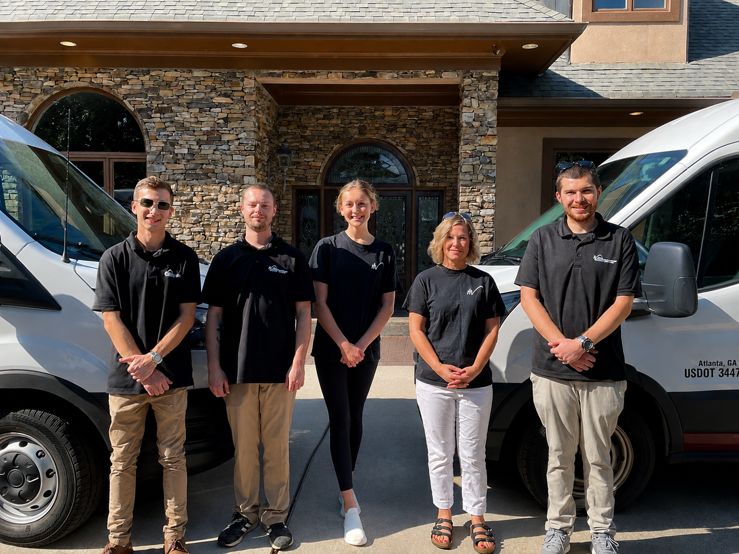 Matrix Mitigation Services team standing with company service vehicles